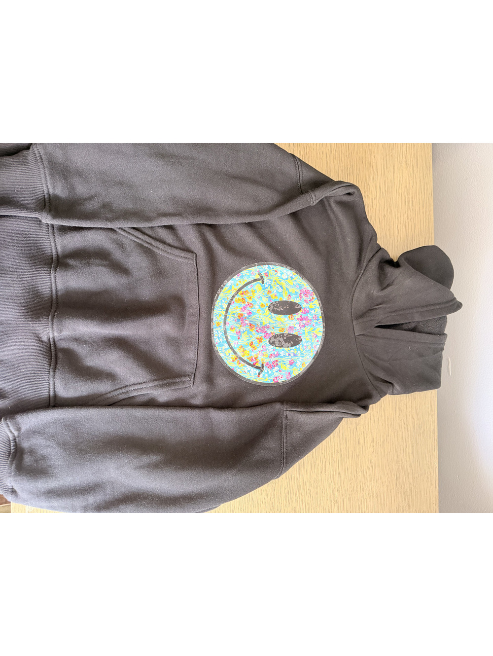 Black Hoodie with Colorful Floral Smiley Face Patch